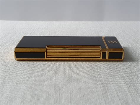 Bật lửa Nhật Givenchy 2000 Black and Gold .